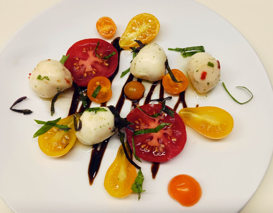 Tomato salad with fresh tomatoes and basil from the garden