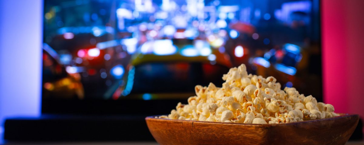 butter popcorn in front of tv screen