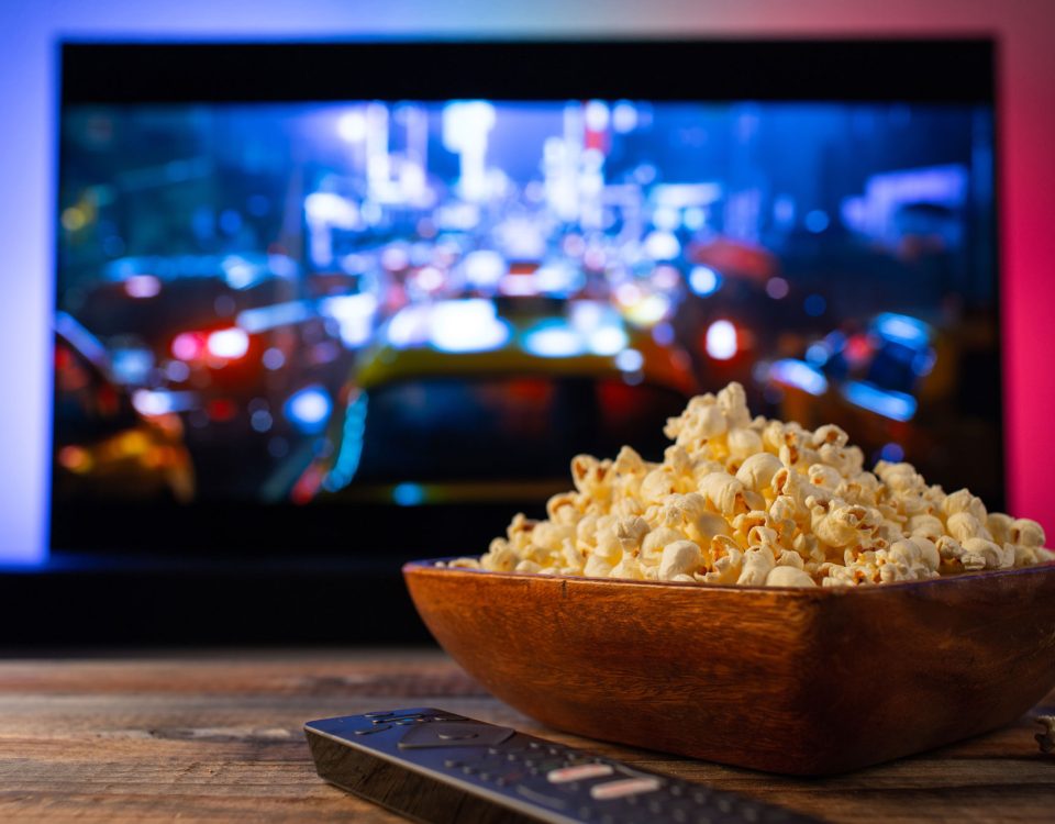 butter popcorn in front of tv screen