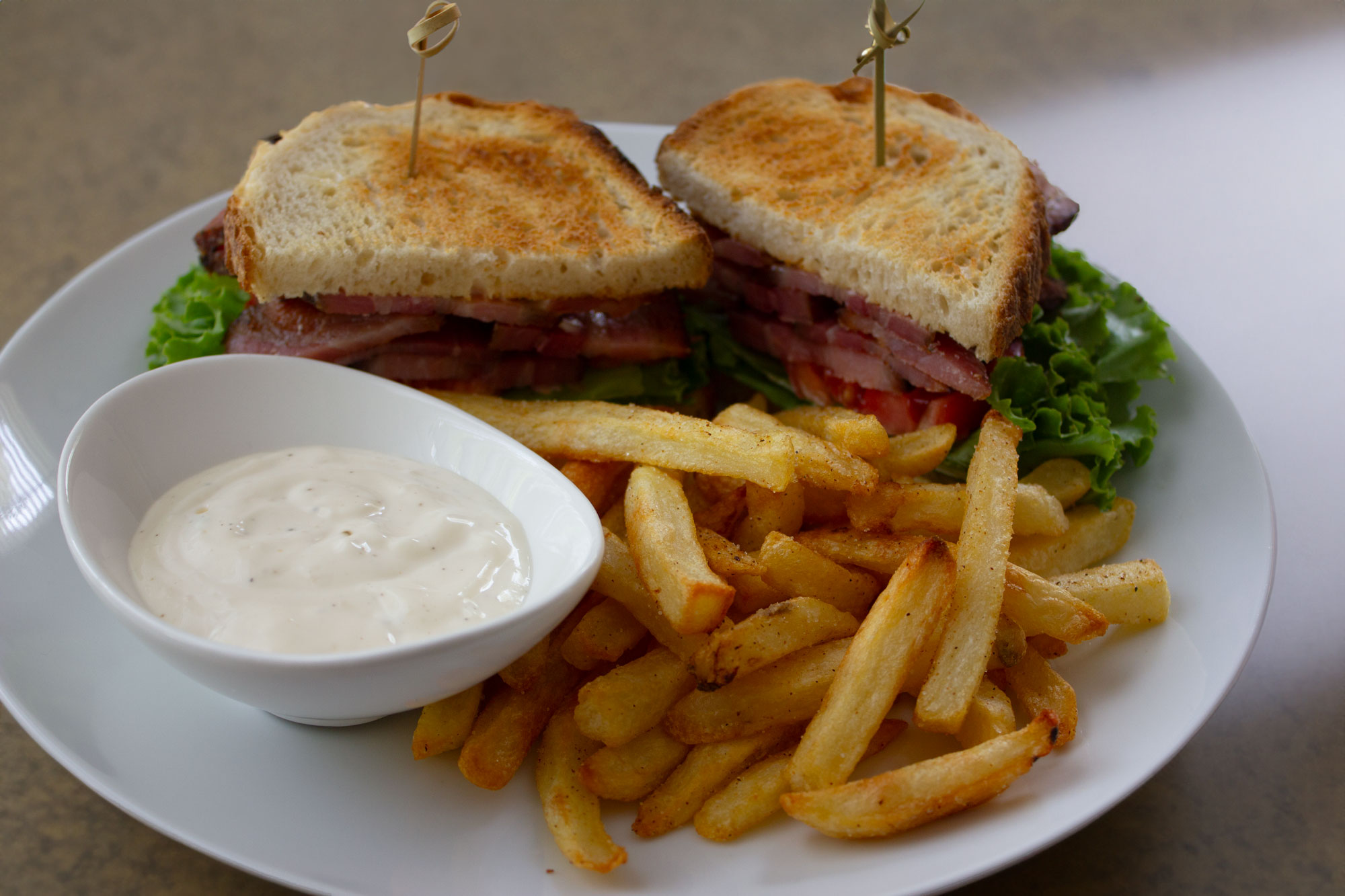 BLT sandwich with garlic aioli and French fries