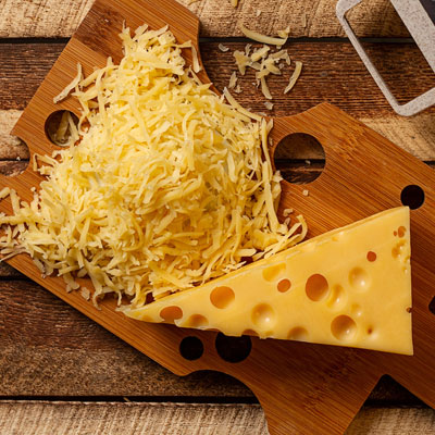 shredded cheese on cheese board